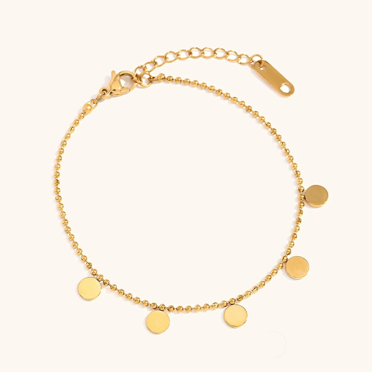 Bracelet doré à pampilles circulaires